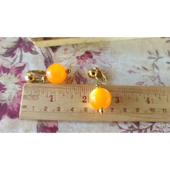 Celebrity Orange Dangling Clip-on Earrings - Picture 7 of 10